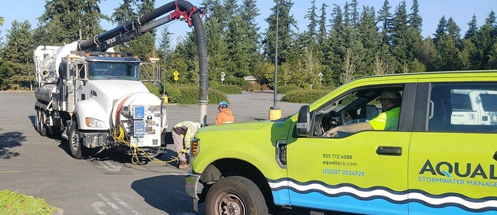 Vacuum truck cleaning storm drain