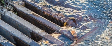 Water flowing into grate