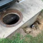 Sinkhole forming along a manhole