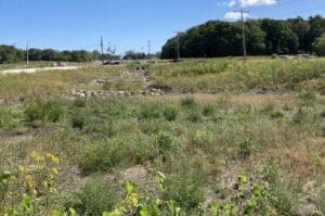 retention pond on the side of a road