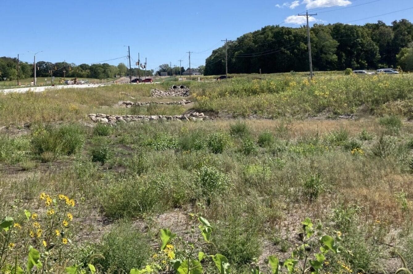 retention pond on the side of a road
