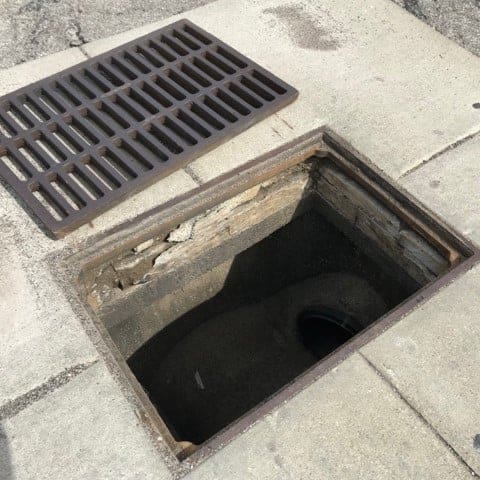 grate removed from a catch basin
