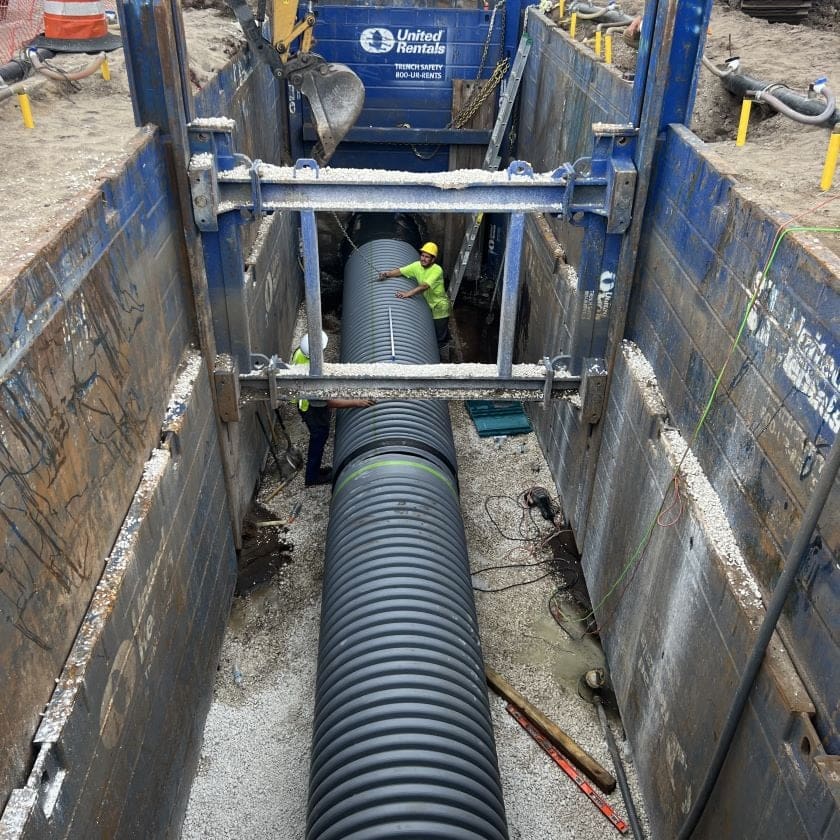 AQUALIS employees repairing a pipe