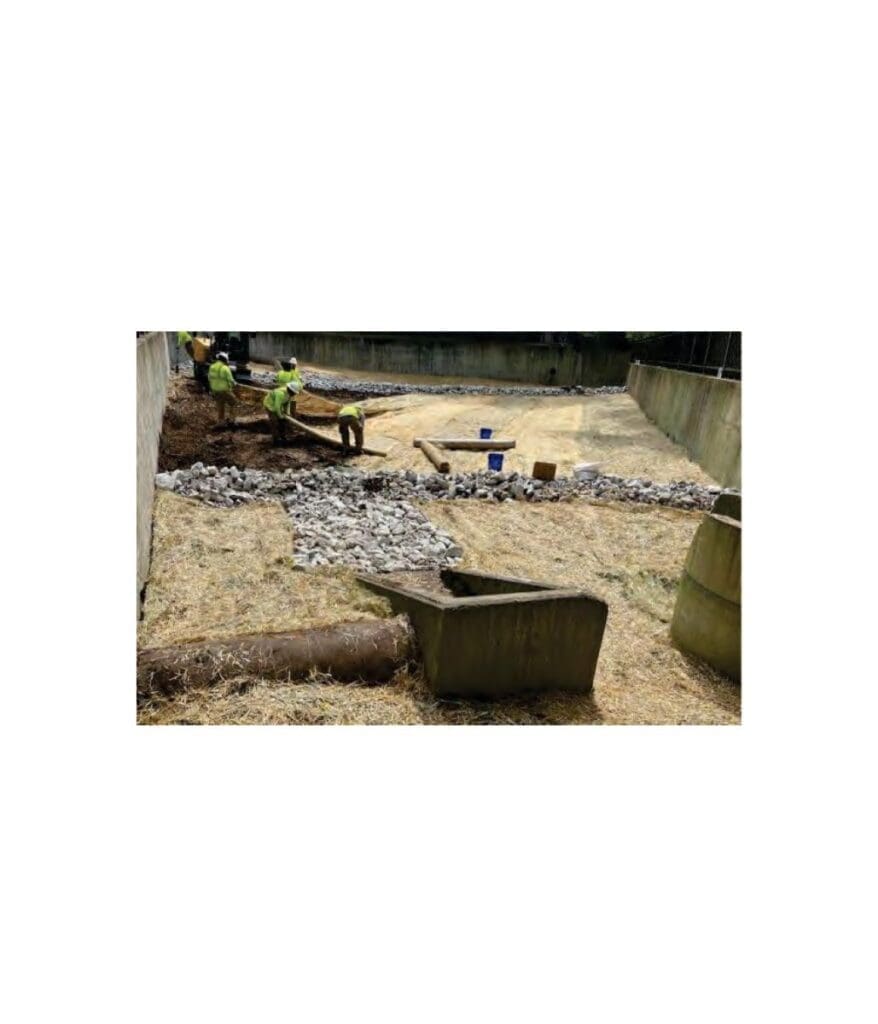 workers laying stabilization mats inside detention basin in Franklin, Tennessee