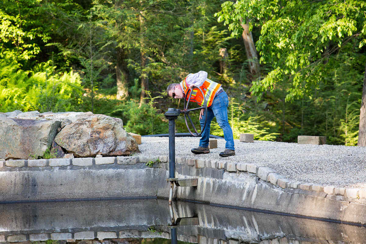 Aqualis team member fixing stormwater system