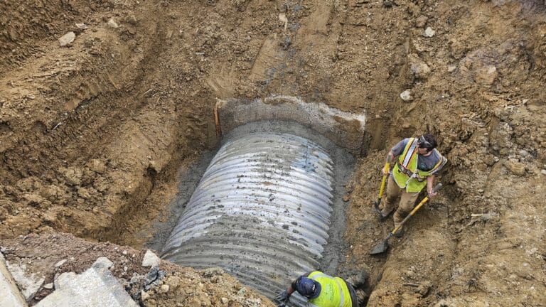 grouting around new pipe